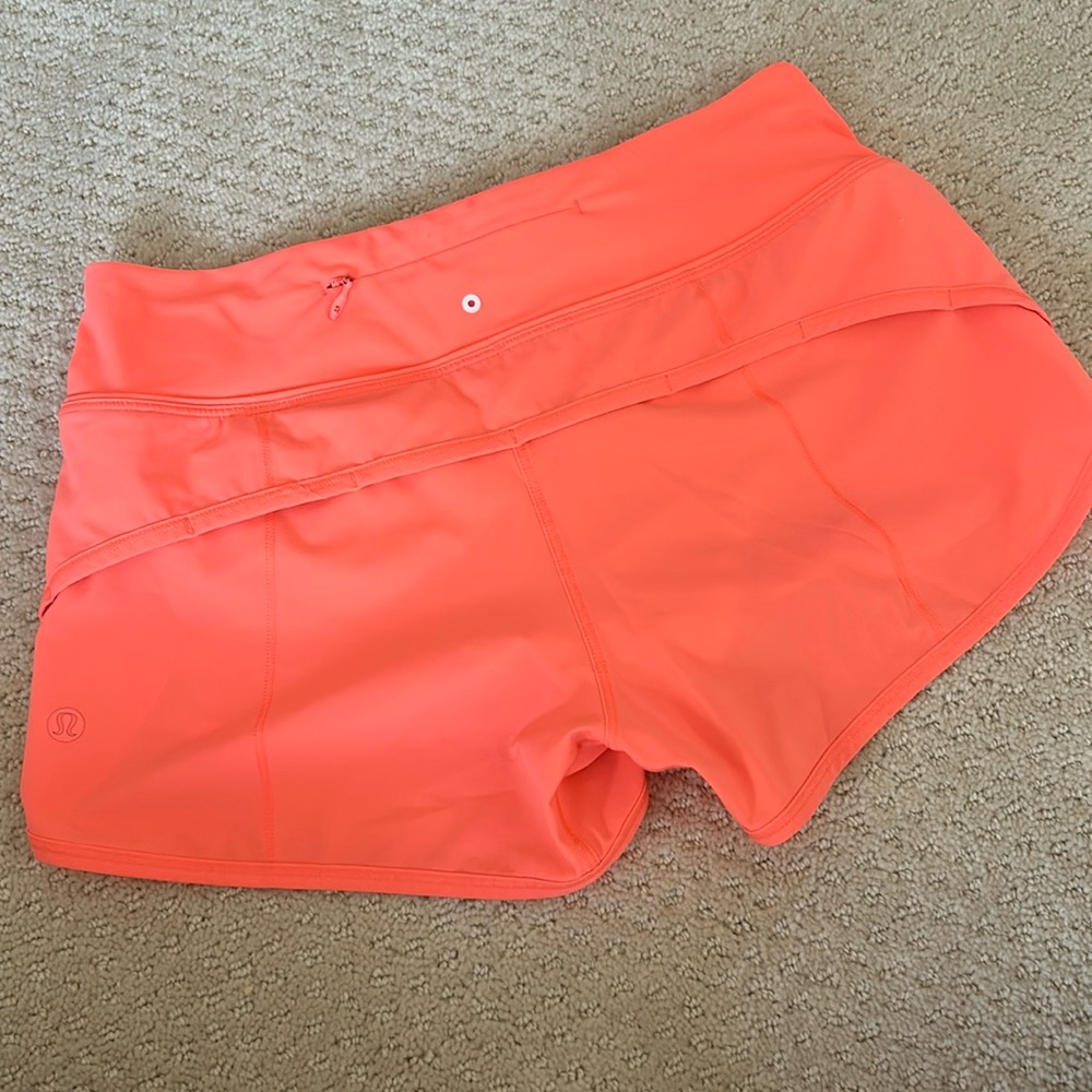 Neon coral Lululemon speed up short low rise lined.